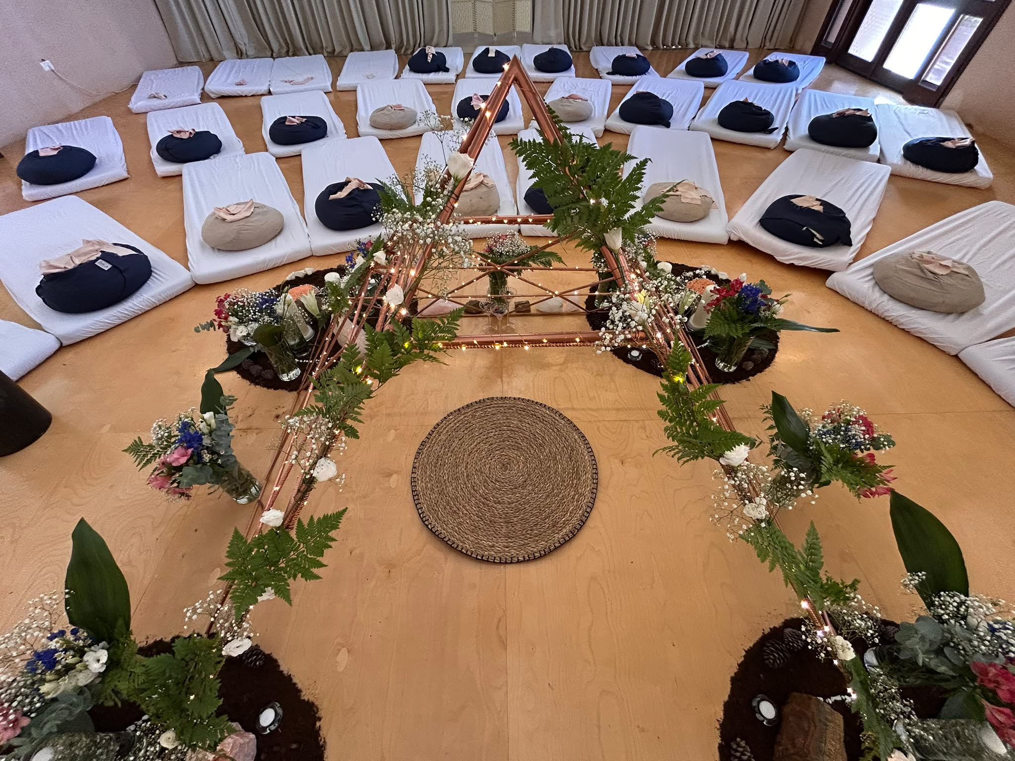 Candlelit earth altar with copper star
